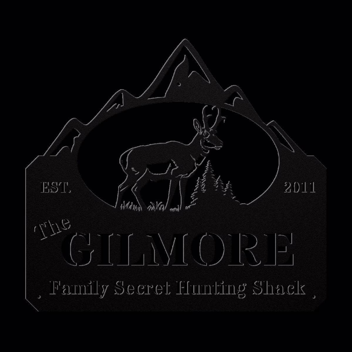 a metal sign with an antelope and mountains
