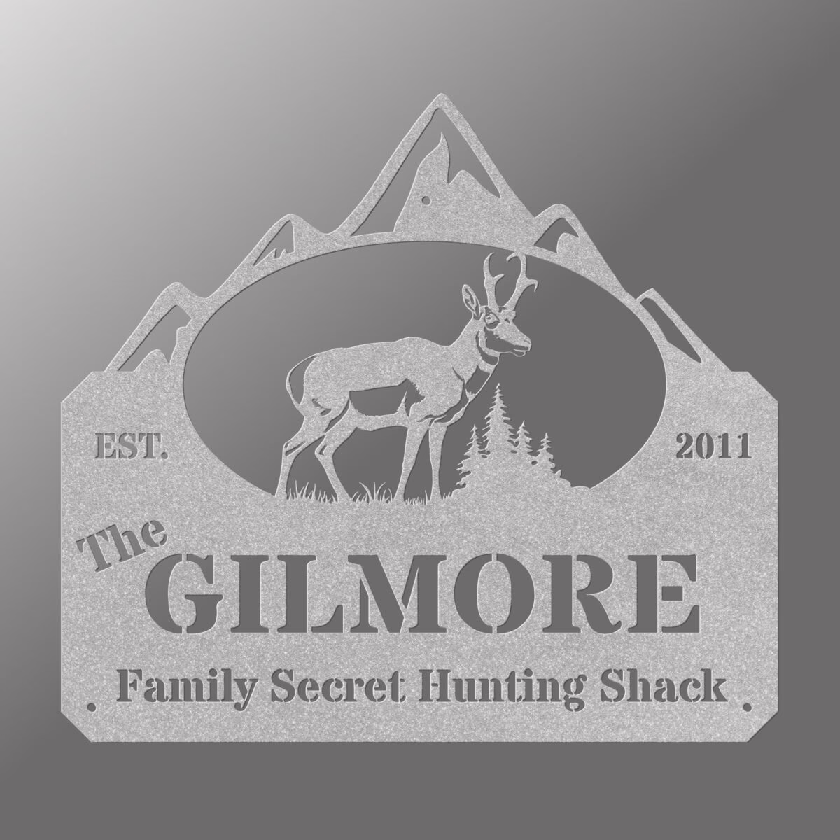 a red sign with an antelope and mountains