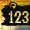 Close up of rustic duck address sign
