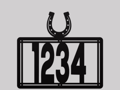 metal house number sign with horseshoe