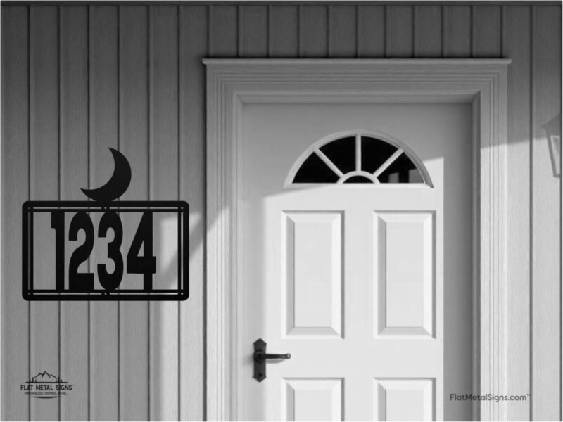 steel house number sign with moon silhouette