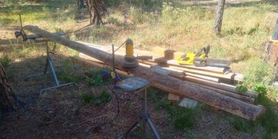One of the sawmill trimmings between two work stands before sanding for the back door awning.